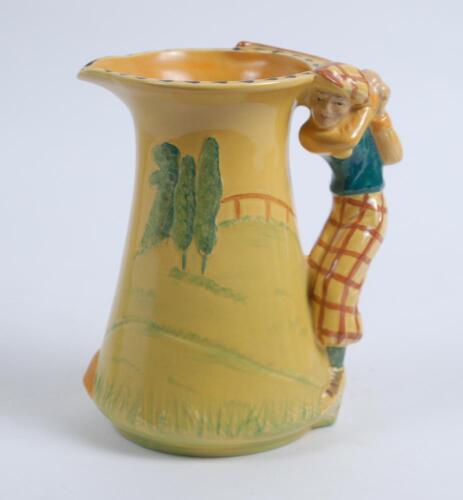 Burleigh Ware ‘Golfer’ jug of tapering shape with handle moulded as a golfer playing a shot, the jug with a golf course painted in colours against a bright yellow ground, 7.75”, This is a reproduction of the 1930’s pieces made in 2000 by Burgess Dorling a