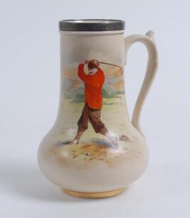 Golfing vase. A rare James MacIntyre silver-mounted pottery vase of bulbous form with handle, the silver collar hallmarked Birmingham, 1897, over a printed and painted depiction of a golfer in plus fours, red jacket and cap, posed in the moment of backswi