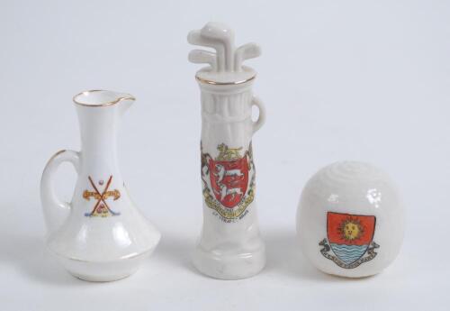 Golf. Three crested china golf ceramics. A golf ball with colour crest for Western Super Mare, a golf bag with clubs with crest for Hunstanton Village (Arcadian) and a small vase with scene of golfer and caddie to side (Folly China). Various sizes. Good c