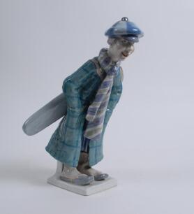 A large ‘Imperial Amphora’ Czechoslovakia figure of a golf caddie standing on a base. Approximately 12” tall. Marks to base. Date unknown