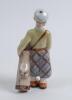 Boy Golfer. A good figure of a boy golfer carrying bag of golf clubs to side clasping it with his left hand. Made by Goldscheider Vienna, Austria circa 1935 with stamp to base and number 704. 8.5” tall. Very good condition - 2