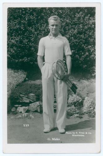 Constantine ‘Gene’ Mako. Original mono real photograph postcard of Mako, standing full length, wearing tennis attire and holding two rackets to his side. Players name printed to lower border. Card no. T13 in a series issued by Edwin Trim & Co. of Wimbledo