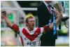 Sean Long. Rugby League. Colour photograph of Long celebrating with the Lance Todd Trophy after being named man of the match during the Powergen Challenge Cup Final match between Huddersfield Giants and St Helens at Twickenham on August 26, 2006. St Helen