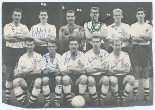 England 1960. Mono printed magazine cutting image of the England team seated and standing in rows wearing football attire. Fully signed in ink by all eleven players. Signatures are Jimmy Armfield, Bobby Robson, Ron Springett, Peter Swan, Ron Flowers, Mick