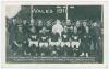 Wales 1911. Mono postcard of the team and officials standing and seated in rows wearing football attire in front of a packed grandstand. Title to top and players’ names printed to lower border. Players featured are Meredith, Wynn, W. Davies, Morris, Vizar