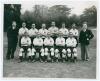 Eddie Baily, England 1951. Two original mono press photographs originally from the personal collection of Baily. One depicts Alf Ramsey, Eddie Baily, Les Medley of England and Ron Burgess of Wales meeting on the pitch, wearing football attire. Handwritten - 3