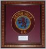 Aston Villa F.C. Original section of carpet reclaimed from the main entrance to the Trinity Road stand when demolished, 20th May 2000. The section depicts the circular Club emblem of rampant lion on blue background to the centre surrounded by ‘Aston Villa