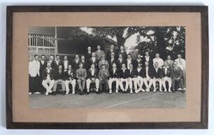 M.C.C. tour to Australia 1928/29. Original mono photograph of the M.C.C. and opposing teams and officials in a joint photograph set behind a pavilion.