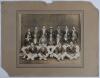 M.C.C. tour to Australia 1928/29. Original mono photograph of the M.C.C. and opposing teams and officials in a joint photograph set behind a pavilion. - 2