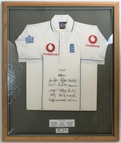 &lsquo;England v Pakistan Test Tour 2005&rsquo;. England short sleeve white shirt with three lions and crown emblem to chest, and sponsor&rsquo;s logos to chest and sleeves. The shirt fully signed to the front by the sixteen playing members of the England touring party. Si