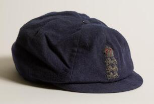 Colin Blythe. Kent & England 1899-1914. England navy blue cloth cricket cap with raised wired emblem of the three lions and crown to front. The cap, by H. Ludlam & Co of Albemarle Street, London, with small peak typical of a pre first world war cap has be