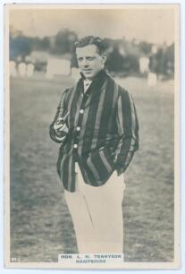 Hon. Lionel Hallam Tennyson. Hampshire & England 1913-1935. Phillips &lsquo;Pinnace&rsquo; premium issue cabinet size mono real photograph trade card of Tennyson standing three quarter length wearing cricket attire and blazer, holding a pipe. No. 97.C. 4&rdquo;x6&rdquo;. Plain b