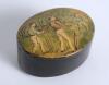 Cricket snuff box. An oval black lacquered papier mache snuff box with hinged lid, believed to be circa 1870&rsquo;s. The lid painted with a cricketing scene of boys playing cricket with trees in background. The box measures approx 2.75&rdquo; x 2&rdquo;x 1.25&rdquo; deep. Good 