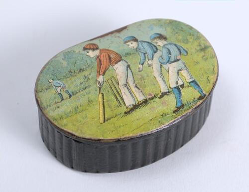 Cricket snuff box. An oval black lacquered papier mache snuff box with hinged lid, believed to be circa 1870&rsquo;s. The lid painted with a cricketing scene of boys playing cricket with trees in background. The box measures approx 2.5&rdquo; x 1.75&rdquo;x .75&rdquo; deep. Some