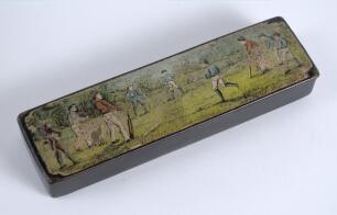 Cricket pencil case. A black laquered papier mache oblong pencil case with hinged lid, believed to be circa 1870/80&rsquo;s. The lid painted with a cricketing scene of boys playing cricket with trees in background. Still containing some of its contents. The cas