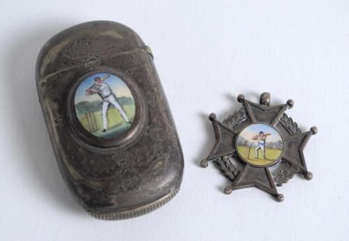 Cricketing vesta case. An oblong shaped silver metal vesta case with oval colour enamel image of a batsman to centre.