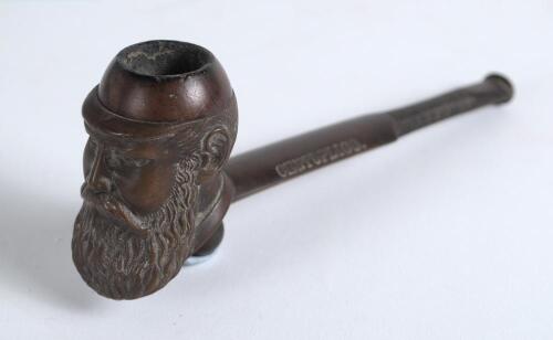 W.G. Grace smoking pipe 1895. Vulcanite cricket pipe with cricket bat shaped stem and &lsquo;Grace head&rsquo; pipe bowl with ball foot to base. Stamped &lsquo;W.G.G. ET.47. A.D. 1895&rsquo;. &lsquo;Centuplico&rsquo; and &lsquo;Made abroad&rsquo; to back of the bat. 5.5&rdquo; long. Good condition
