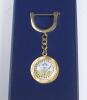 Halcyon Days cricket key ring. Gold metal disc on chain, set with circular enamel design of cricket bats, balls and stumps. &lsquo;Halcyon Days Enamels&rsquo; stamped to verso. In original presentation box. Very good condition. - 2