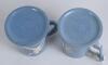 Dartmouth Pottery. Two blue and white tankards, one of cricket with a batsman and wicket -keeper to one side and bowler to the other and the other, football with player kicking the ball to one side and ball and part of the goal to the other. The football - 3