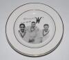 &lsquo;Celebrating the 3 W&rsquo;s&rsquo;. Dinner plate with transfer image of Frank Worrell, Cylde Walcott and Everton Weekes with facsimile signatures and title. Gold lustre to rim. Registration mark to underside, &lsquo;100&rsquo;. Maker unknown. 10&rdquo; diameter. Very good condition.