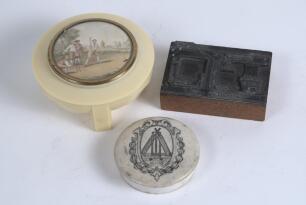 Cricketing pot-lid. Original circular pot-lid printed in black with crossed bats, stumps and balls within a cartouche.
