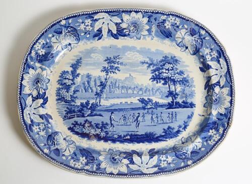 &lsquo;Cricket at Windsor Castle meat dish&rsquo;. A very large oval shaped Goodwin & Harris &lsquo;Metropolitan Scenery&rsquo; meat dish printed in blue and embellished with a scene of Windsor Castle and the Thames to foreground featuring a cricket match to the foreground with 
