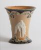 Doulton Lambeth stoneware mug in art nouveau style, with three moulded relief vignettes of cricketers, a batsman, bowler and wicket keeper, Abel, Woods and McGregor in white on a brown background, with floral leaf decoration above and below in green and g - 2