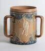Doulton Lambeth stoneware tyg. Large, than normal, and impressive three handled tyg with three moulded relief vignettes of cricketers, a batsman, a fielder and wicket keeper in white on a green cameo background with blue circular surround, the sides highl