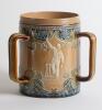 Doulton Lambeth stoneware tyg. Large, than normal, and impressive three handled tyg with three moulded relief vignettes of cricketers, a batsman, a fielder and wicket keeper in white on a green cameo background with blue circular surround, the sides highl - 3
