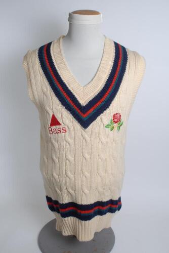 Lancashire white 1st XI sleeveless sweater, by Luke Ayres, with trimming to collar and waist in club colours, Lancashire emblem and sponsors logo &lsquo;Bass&rsquo; to chest. Size 40&rdquo;. Player unknown. Good condition