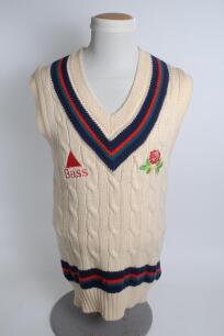 Lancashire white 1st XI sleeveless sweater, by Luke Ayres, with trimming to collar and waist in club colours, Lancashire emblem and sponsors logo &lsquo;Bass&rsquo; to chest. Size 40&rdquo;. Player unknown. Good condition