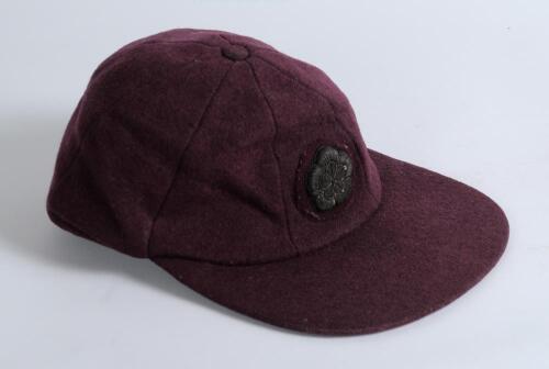 Northamptonshire C.C.C. maroon cloth 1st XI cricket cap. Earlier cap with attached wired Northamptonshire emblem. Possibly 1950&rsquo;s. Good condition. Player unknown
