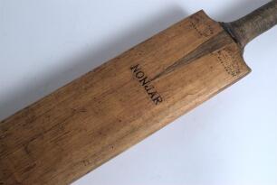 Gunn & Moore &lsquo;Nonjar&rsquo; cricket bat c1910. Stamps for &lsquo;Gunn & Moore Nonjar&rsquo; to front and impressed &lsquo;Reblade&rsquo; stamp to back. The blade is &lsquo;reblade&rsquo; provided by the manufacturer, a service often used in those days. The handle is made of a mixture of many cane