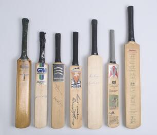 Signed miniature cricket bats. Seven miniature bats of various sizes including a Gradidge &lsquo;Jack McGlew Autograph&rsquo; bat signed by twelve South Africans c.1950, bats individually signed by Garry Sobers, Alec & Eric Bedser, Graham Corling, Andrew Strauss & An