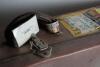 Derek Leslie Underwood. Kent & England 1963-1987. Two cricket coffins, one in brown decorated in M.C.C./ England colours with &lsquo;D. Underwood M.C.C. Team&rsquo; stencilled to lid. Luggage identity tag attached to handle with Underwood&rsquo;s name &lsquo;c/o International Wa - 3