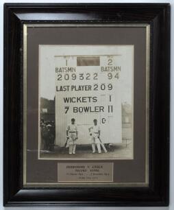 &lsquo;Derbyshire v. Essex Record Score&rsquo; 1929. Large original mono photograph of the Derbyshire opening batsmen, H. Storer and J. Bowden standing in front of the scoreboard having made a then record first wicket partnership in the match played at Derby 29th Jun