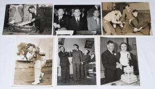 M.C.C. tour to Australia 1946/47. Six original mono and sepia press photographs of England and Australia players. Images depict Laurie Fishlock packing his cricket bag prior to the tour, Alec Bedser and others amongst the audience at a social event, playe