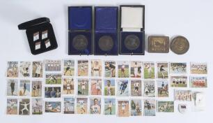 Olympic Games 1928-1996. Selection of collectors&rsquo; cards, medals, badges etc. Includes forty two German colour collectors&rsquo; cards for the 1928 Amsterdam Olympic Games. An unusual cigarette tin for the Olympic Games Berlin 1936 with &lsquo;1936&rsquo; and emblem to top 