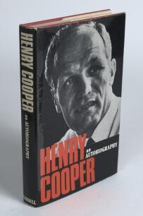 &lsquo;&rsquo;Henry Cooper. An Autobiography&rsquo;. London 1972. Hardback with good dustwrapper. Presentation copy to the sports journalist and author, Gordon Ross, signed with dedication to title page by Cooper. Bookplate of Ross to front endpaper. Sold with an original 