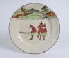 Royal Doulton. Two &sbquo; &lsquo;Golfing series&rsquo; plates, decorated to face in colour with cavalier figures (Charles Crombie) playing golf, one with proverb inscription &lsquo;Give losers leave to speak and winners to laugh&rsquo;, the other with &lsquo;He that always complains is nev