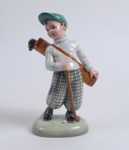 An earthenware figure of a boy golfer, circa 1937. Made by Stefan Dakon,Austria, 1904-1992 for Keramos. 9&rdquo; tall. Printed factory marks and &lsquo;Dakon&rsquo;, impressed numbers &lsquo;2121/32/L to base. Very good condition. Sold with a brown vase with figure of a boy golf
