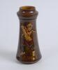 An earthenware figure of a boy golfer, circa 1937. Made by Stefan Dakon,Austria, 1904-1992 for Keramos. 9&rdquo; tall. Printed factory marks and &lsquo;Dakon&rsquo;, impressed numbers &lsquo;2121/32/L to base. Very good condition. Sold with a brown vase with figure of a boy golf - 4