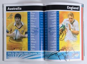 England Rugby World Cup Winners 2003. Official match programme for the final, Australia v England, played at Sydney 22nd November 2003. Signed to the centre pages by six England players. Signatures are Martin Johnson (Captain), Will Greenwood, Matt Dawson