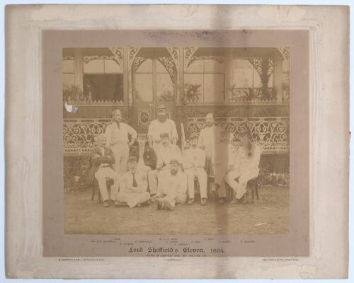 &lsquo;Lord Sheffield&rsquo;s Eleven 1884&rsquo;. Early original sepia photograph of Lord Sheffield&rsquo;s team who played the Australians at Sheffield Park, Uckfield, East Sussex on the 12-14th May 1884, standing and seated, in rows wearing blazers, caps and cricket attire. Th