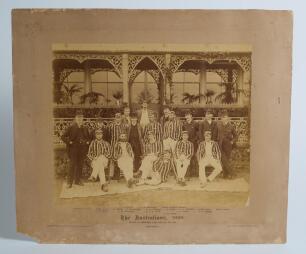 &lsquo;The Australians 1886&rsquo;. Original sepia photograph of the Australian team who played Lord Sheffield&rsquo;s Eleven at Sheffield Park, East Sussex on the 13-15th May 1886, standing and seated, in rows wearing blazers, caps and cricket attire.