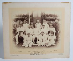 &lsquo;Lord Sheffield&rsquo;s Eleven 1894&rsquo;. Original sepia photograph of Lord Sheffield&rsquo;s team who played the South African Eleven at Sheffield Park, East Sussex on the 22-23rd May 1894, standing and seated, in rows wearing caps and cricket attire. The Umpires, Thoms