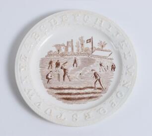 Alphabet cricket plate. 19th Century earthenware circular &lsquo;Alphabet&rsquo; child&rsquo;s plate with cricket scene to centre, transfer printed in brown within the letters of the alphabet to rim. 6.75&rdquo; diameter. &lsquo;Staffordshire, England&rsquo; stamped to verso. Good/very good