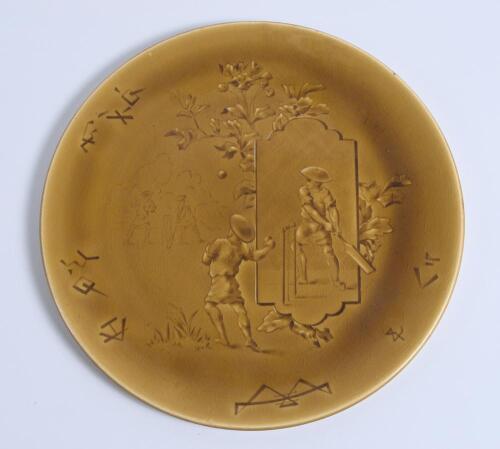 Cricket plate. A Rare Choisy Le-Roi Majolica mustard and green cricket plate depicting an Asian cricket match in the French Empire (Vietnam) with images of children (oriental) playing cricket to centre with foliage decoration and signed HB in chinese sign