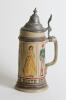 German beer stein. A striking German-made stein circa 1880s. Classic German stoneware with a pewter lid and decorated with colourful images in panels of cricket, football, tennis, croquet and hockey. Around the base is the German motto &lsquo;Maass und Ziel das