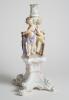 Cricket themed candlestick. Large ceramic candlestick the centre features two winged cherubs holding cricket bats on plinth, the base with four feet. A very colourful design in pastel coloured glaze in pink, light blue, mauve and yellow with gilt lustre. - 3